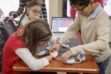 3 children working together using the code jumper