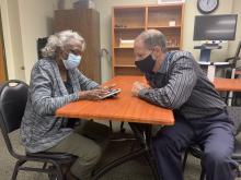 Dorothy receiving Assistive Technology Training on her iPhone by Lighthouse instructor Chris Sacca