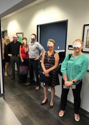 Students blindfolded, gaining an awareness of the challenges faced by people who are visually impaired.
